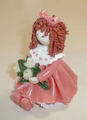 Bambola con rose