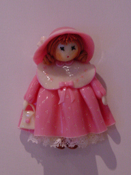 Bambola con borsa e cappello rosa