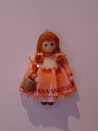 Bambola con cestino